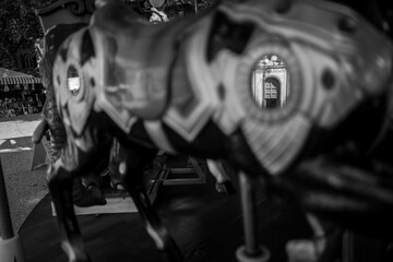 Fototapeta na wymiar a reflection o a merry-go-round horse in Lucca