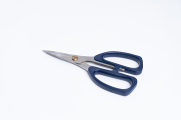 top view of a pair of blue color plastic scissors isolated on white background
