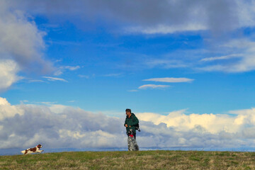 calling the dogs outdoors, off leash, obedient dogs
