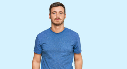 Fototapeta premium Handsome caucasian man wearing casual clothes relaxed with serious expression on face. simple and natural looking at the camera.
