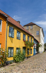 Fototapeta na wymiar Colorful houses in a cobblestoned street of Flensburg, Germany
