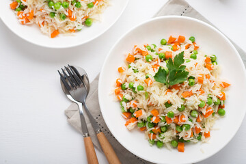 Boiled rice with vegetables, traditional Oriental dish
