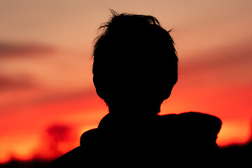silhouette of a person at sunset