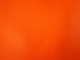 Abstract background made of bright orange fabric