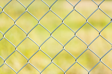 steel fence with green background