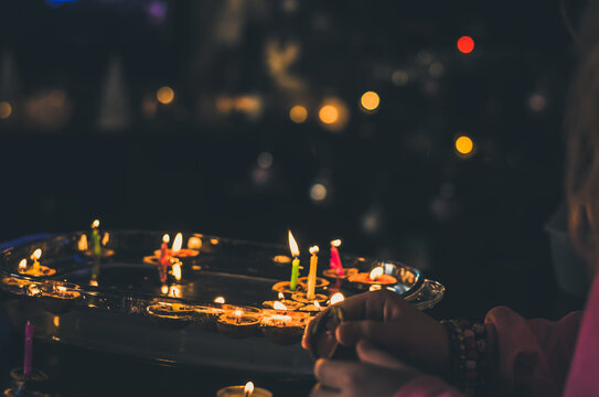 christmas traditional customs  - nut shell with burning candle floating on water