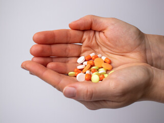 Close-up pills in the woman's palms