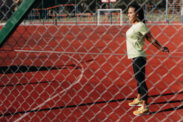 Healthy and strong woman warming up before training