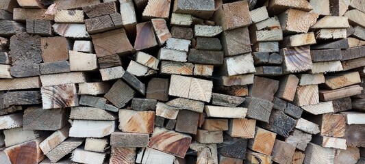 Abstract background from the ends of the old boards. Close-up. Place for text. Natural wood background. High quality photo