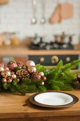 Rustic kitchen details for Christmas. Rustic kitchen table setting and decor for New Year close-up and copy space.