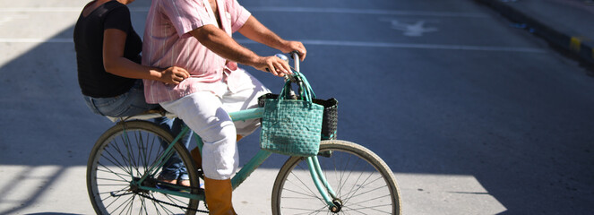 two people riding a bicycle