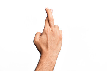 Hand of caucasian young man showing fingers over isolated white background gesturing fingers crossed, superstition and lucky gesture, lucky and hope expression