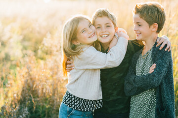 Portrait of young siblings hugging each other