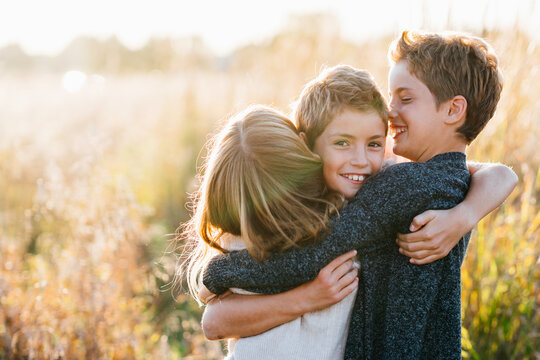 Portrait of young siblings hugging each other
