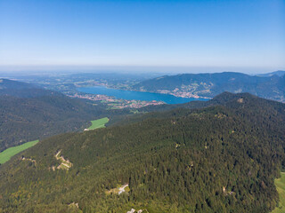 Aerial view of lake Tegernsee from Hirschberg against blue sky