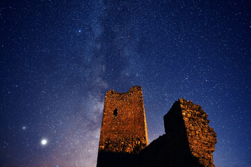a castle with the milky way in the background