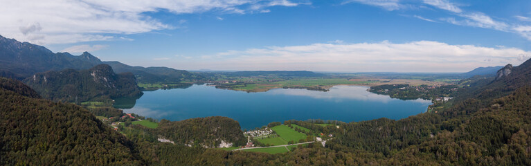 Fototapeta na wymiar Aerial view of lake kochel with blue sky in the background