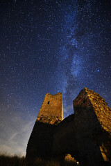 a castle with the milky way in the background