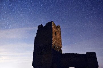 a castle with the milky way in the background
