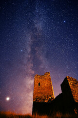 a castle with the milky way in the background