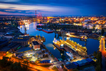 Amazing scenery of the shipyard and canals of Gdansk at dusk. Poland