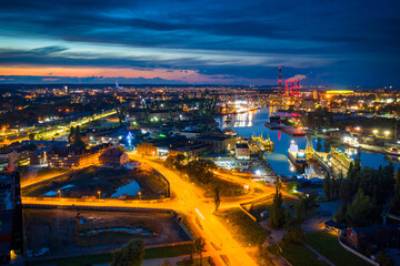 Fototapeta na wymiar Amazing scenery of the shipyard and canals of Gdansk at dusk. Poland