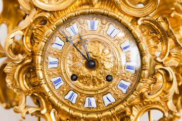Fototapeta na wymiar Vintage grandfather clock dial with golden decoration