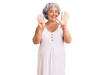 Senior woman with gray hair wearing casual clothes showing and pointing up with fingers number nine while smiling confident and happy.