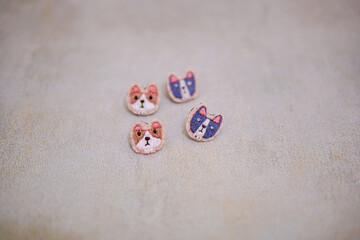portrait of a cat that is embroidered by hand on cloth into a brooch