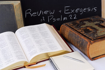 Obraz premium Working on scripture assignment with large bibles