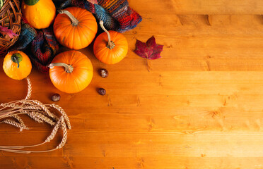 Happy Thanksgiving day composition orange pumpkins with autumn leaves on a wooden rustic table copy space