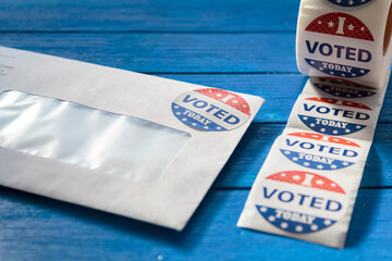 Envelope with voting ballot papers sent by mail for absentee vote in presidential election and I Voted today stickers