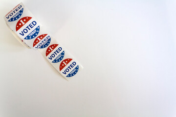 Top view of Roll of I Voted Today stickers on white background with copy space. US presidential election concept