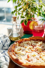 pizza on a checkered napkin in a cafe on the table natural sunlight