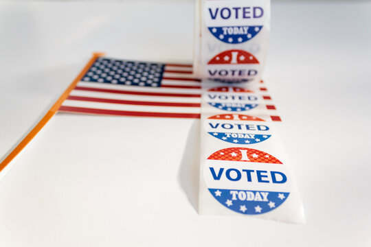 I Voted Today stickers and american flag on white background