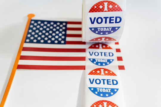 I Voted Today stickers and USA flag on white background