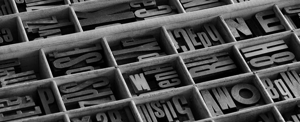 Old letterpess background. Collection of vintage block letters made of wood