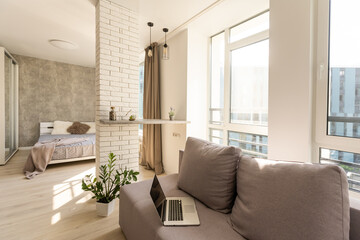 laptop is on the couch in modern minimalist design of bright living room