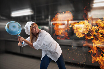 Woman chef is worried becouse the kitchen is on fire