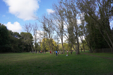 The vast space in the Vaugrenier park in the city of Villeneuve-Loubet, people having picnics and relaxing on an autumn Sunday afternoon.
