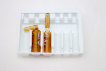 Empty medical ampoules infusion after injection isolated on white background
