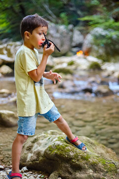 Boy In The Woods Talking On The Radio