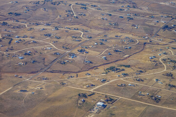 Aerial view of of farm in suburban of Denver in Colorado and the country road