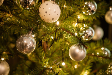 Obraz na płótnie Canvas Festive balloons on the Christmas tree , beautiful background