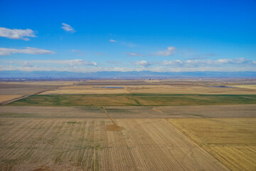 Fototapeta premium Aerial view of of farm in suburban of Denver in Colorado and the country road 