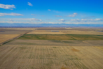 Aerial view of of farm in suburban of Denver in Colorado and the country road