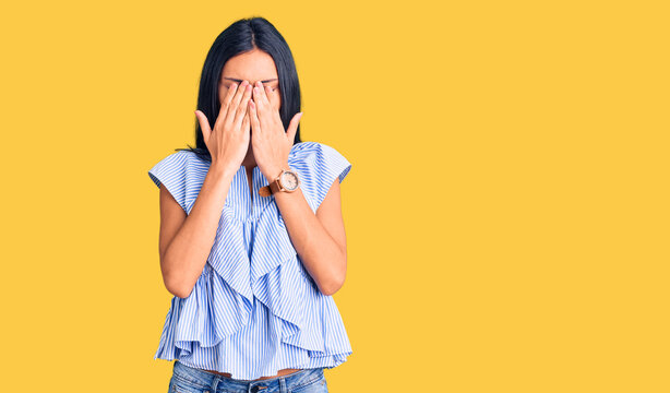 Young beautiful latin girl wearing casual clothes rubbing eyes for fatigue and headache, sleepy and tired expression. vision problem