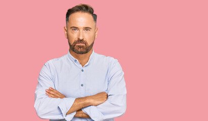 Handsome middle age man wearing business shirt skeptic and nervous, disapproving expression on face...