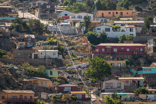 Coquimbo, Chile - December 7, 2008: Closeup of part of hill filled with houses and cut in half by zig-zag steps linking street with harbor.