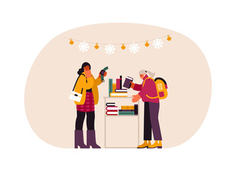 Women choosing various Christmas gifts in shop